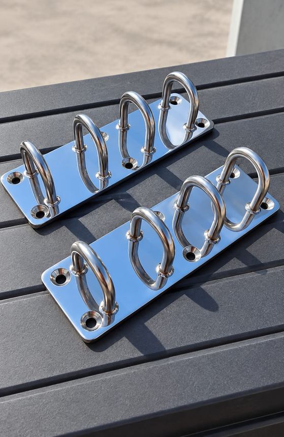 Polished stainless rod holders on a teak deck